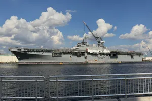 a large military ship docked in the water jigsaw puzzle