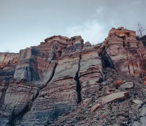 Majestic view of eroded rock formations showcasing geological layers in a barren canyon. jigsaw puzzle