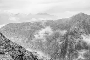 A dramatic misty mountain landscape in Divriği, Türkiye showcasing rocky ridges and clouds. jigsaw puzzle