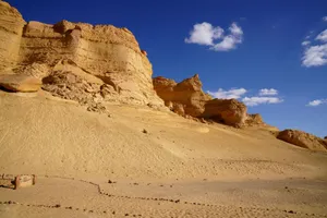 Scenic view of dramatic sandstone cliffs in Egypt's desert under a bright blue sky. jigsaw puzzle