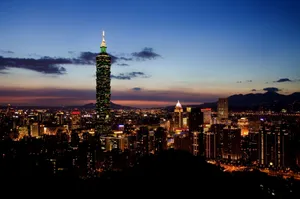 Stunning view of Taipei 101 and cityscape illuminated at twilight showcasing urban charm and vibrant lights. jigsaw puzzle