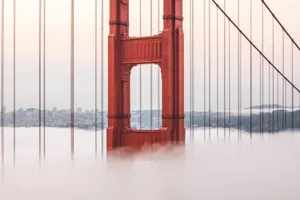 Iconic Golden Gate Bridge emerging through misty morning fog in San Francisco. jigsaw puzzle