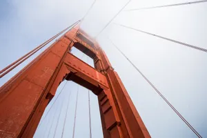 Dramatic view of the Golden Gate Bridge tower enveloped in fog, San Francisco. jigsaw puzzle
