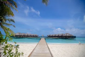 Stunning overwater villas on a tropical beach resort with clear skies and turquoise waters. jigsaw puzzle