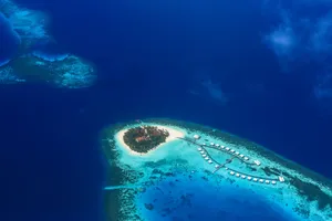 Stunning aerial shot of a tropical island paradise surrounded by turquoise waters in the Maldives. jigsaw puzzle