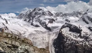 Breathtaking view of the snow-covered Alps in Zermatt, Valais, showcasing stunning mountain peaks and glaciers. jigsaw puzzle