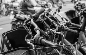 Close-up of bicycle handles parked on a Basel street in black and white. jigsaw puzzle