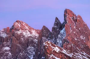 Jagged mountain peaks with snow at sunrise jigsaw puzzle