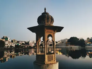 a water fountain in front of a body of water jigsaw puzzle