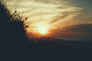 a sunset over a mountain jigsaw puzzle