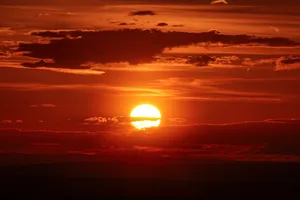 the sun is setting in the sky with clouds jigsaw puzzle