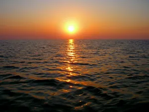 a sunset over the ocean jigsaw puzzle