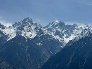Majestic view of snowcapped Himalayan mountains under a clear blue sky. jigsaw puzzle