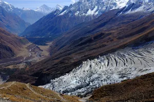 Stunning view of a Himalayan glacier surrounded by mountains under a clear sky. jigsaw puzzle