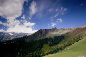 Stunning view of a mountain range under a vibrant blue sky in Himachal Pradesh, India. jigsaw puzzle