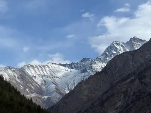 Majestic view of snow-covered mountains under clear blue sky. jigsaw puzzle