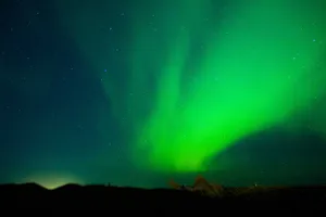 Dazzling display of aurora borealis under a starry night sky, perfect for scenic backdrops. jigsaw puzzle