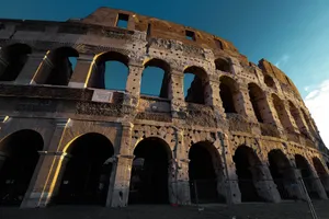 Stunning view of the Colosseum with warm evening light highlighting its historic architecture. jigsaw puzzle
