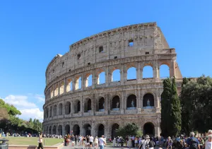 Iconic Colosseum in Rome, Italy, bustling with tourists on a sunny day. jigsaw puzzle