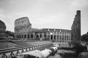 Classic black and white photograph of the iconic Roman Colosseum under a clear sky. jigsaw puzzle