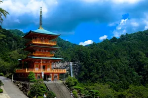 Beautiful view of Kumano Nachi Taisha with a pagoda surrounded by lush green mountains and a waterfall. jigsaw puzzle