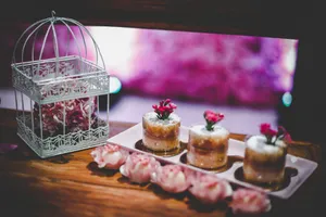 Artistic mini desserts garnished with flowers, ideal for weddings or special events. jigsaw puzzle