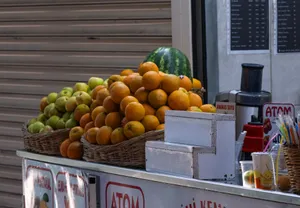 Vibrant fruit stand with oranges and apples in İzmir, showcasing local street culture. jigsaw puzzle