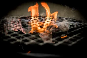 Vivid flames dance over a grill, ideal for cooking concepts and barbecue themes. jigsaw puzzle