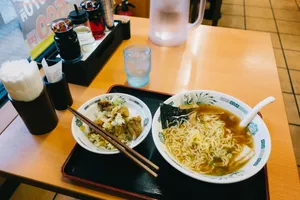 Delicious bowl of ramen and rice in a traditional Tokyo restaurant setting. jigsaw puzzle