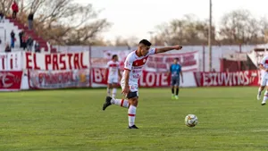 Football player in action during an outdoor match at a local stadium. jigsaw puzzle