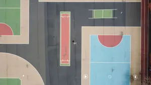 Colorful sports courts captured from above in Brooklyn's urban setting. jigsaw puzzle