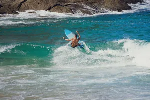 Surfer rides a powerful wave on a sunny day, capturing the essence of adventure and excitement. jigsaw puzzle