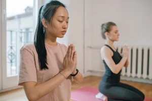 Two women engaging in a serene yoga practice, focusing on meditation for mental wellness. jigsaw puzzle