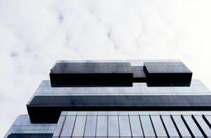 Contemporary building with a glass facade and geometric patterns, low angle view. jigsaw puzzle