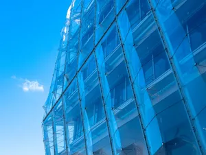 Striking facade of modern glass architecture in Hamburg against a clear blue sky. jigsaw puzzle
