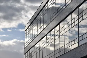 Clouds reflecting on a sleek office building facade in Amsterdam. Urban architecture. jigsaw puzzle