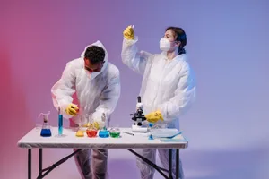 Two scientists in protective gear conducting experiments with colorful chemicals in a lab. jigsaw puzzle