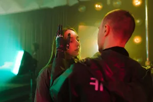 A man with a prosthetic hand gently touches a woman's face in a cyberpunk setting. jigsaw puzzle