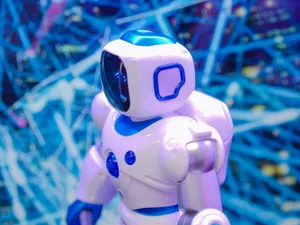 Close-up of a white and blue robot against a dynamic, futuristic tech backdrop. jigsaw puzzle