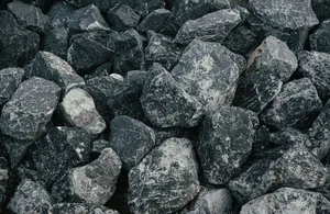 Close-up of natural black and white rocks creating a textured background. jigsaw puzzle