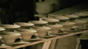 Close-up of unfinished ceramic bowls lined up in a pottery workshop. jigsaw puzzle