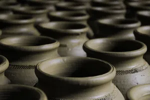 Rows of handcrafted clay pots in a pattern for pottery enthusiasts. jigsaw puzzle