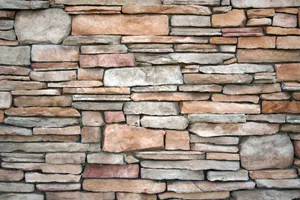 High-resolution image of a natural stone wall with various textures and earthy tones. jigsaw puzzle