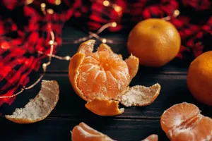 A peeled mandarin surrounded by festive decor, capturing the essence of freshness and celebration. jigsaw puzzle